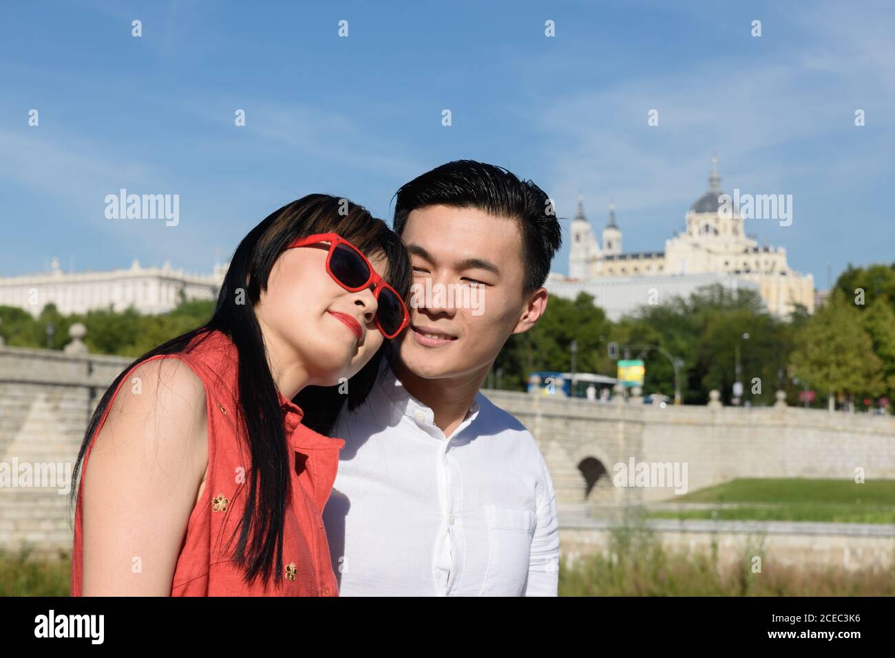 Asian couple standing in park Stock Photo
