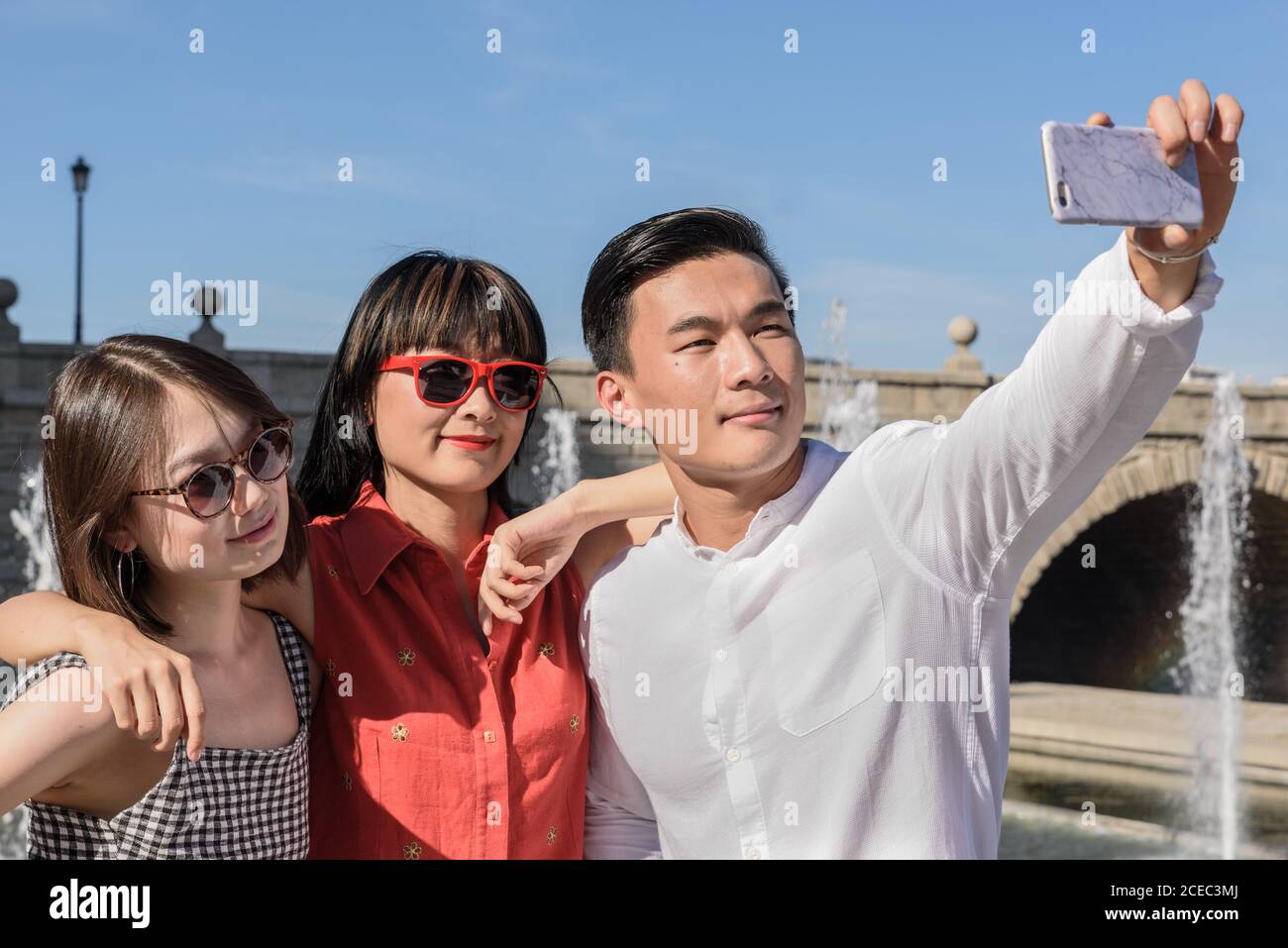 Happy tourists standing near hi-res stock photography and images - Alamy