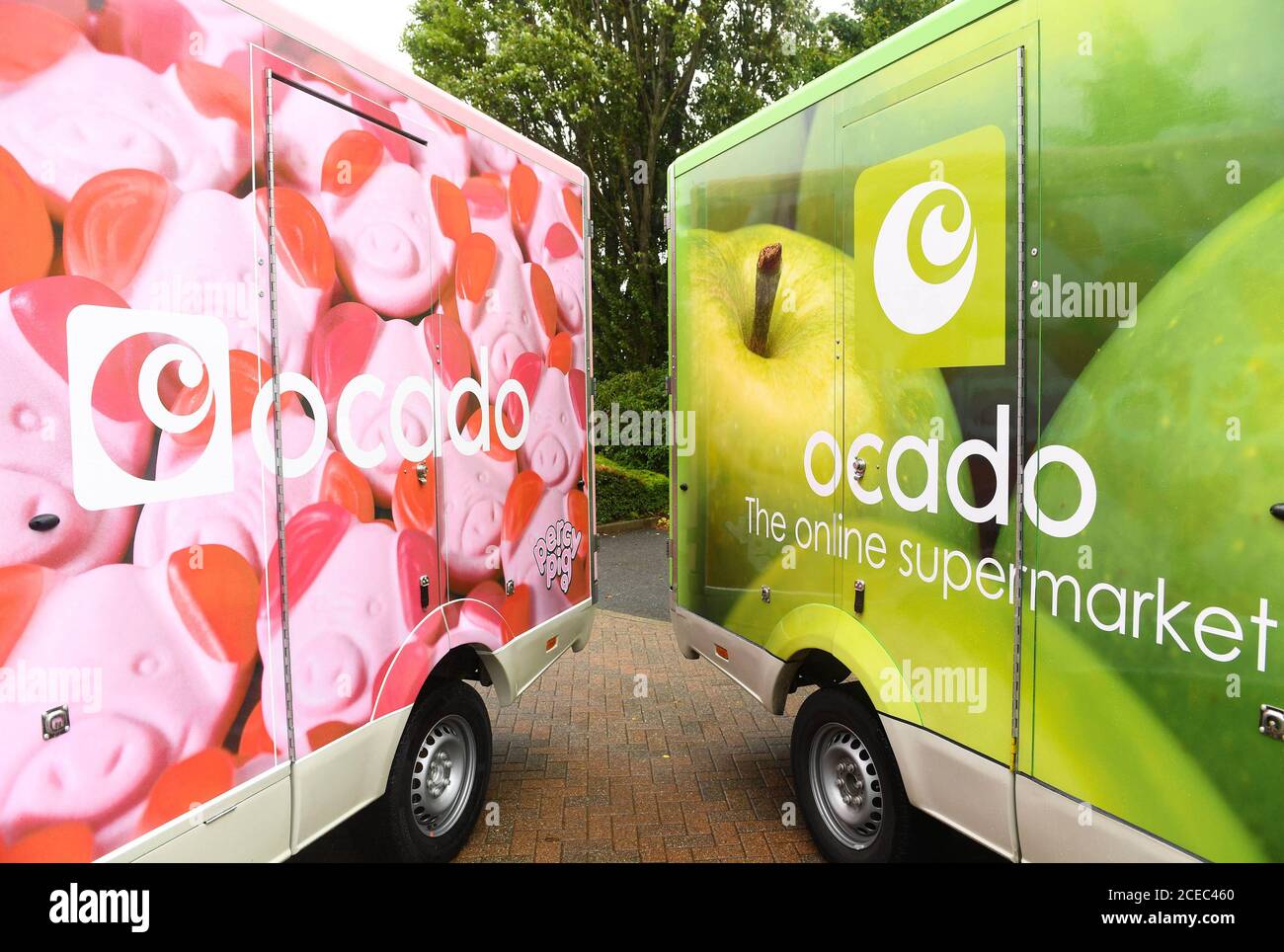 EDITORIAL USE ONLY A fleet of limited-edition Percy Pig delivery vans are unveiled as Ocado marks the arrival of the full M&S Food range to the online supermarket's website from today, September 1st. Stock Photo