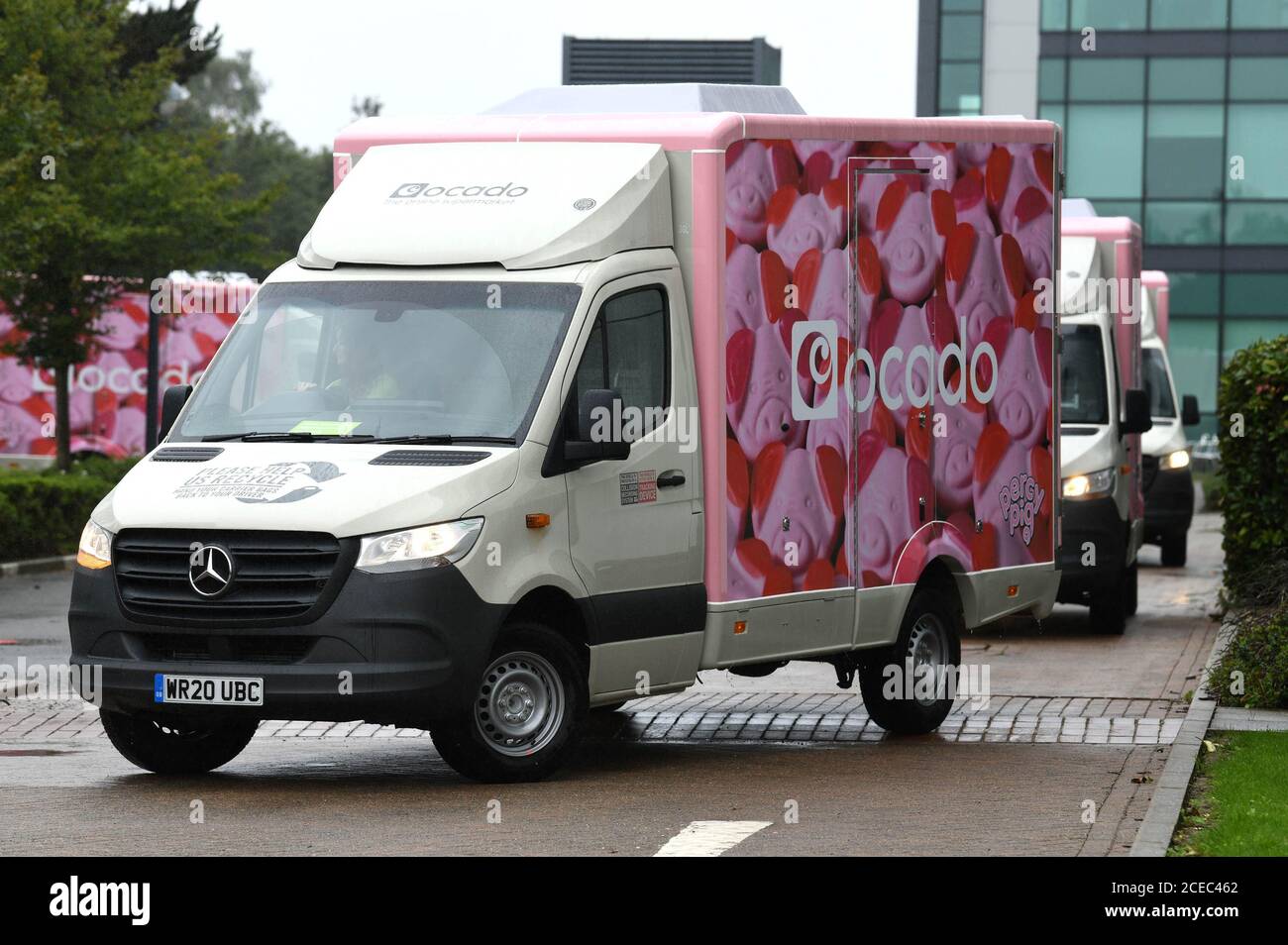 EDITORIAL USE ONLY A fleet of limited-edition Percy Pig delivery vans are unveiled as Ocado marks the arrival of the full M&S Food range to the online supermarket's website from today, September 1st. Stock Photo