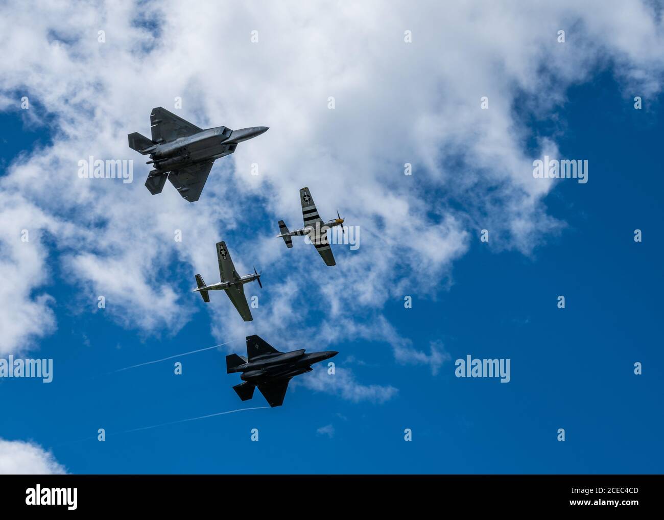 U.S. Air Force Capt. Kristin “Beo” Wolfe, F-35 Demonstration Team pilot, flies alongside Maj. Joshua “Cabo” Gunderson, F-22 Demonstration Team pilot, and two P-51 Mustangs as part of a heritage flight formation Aug. 30, 2020, Orange County Airport, NY. The heritage flight was flown as part of the 2020 New York Air Show, which was held in a drive-in format. (U.S. Air Force photo by Capt. Kip Sumner) Stock Photo