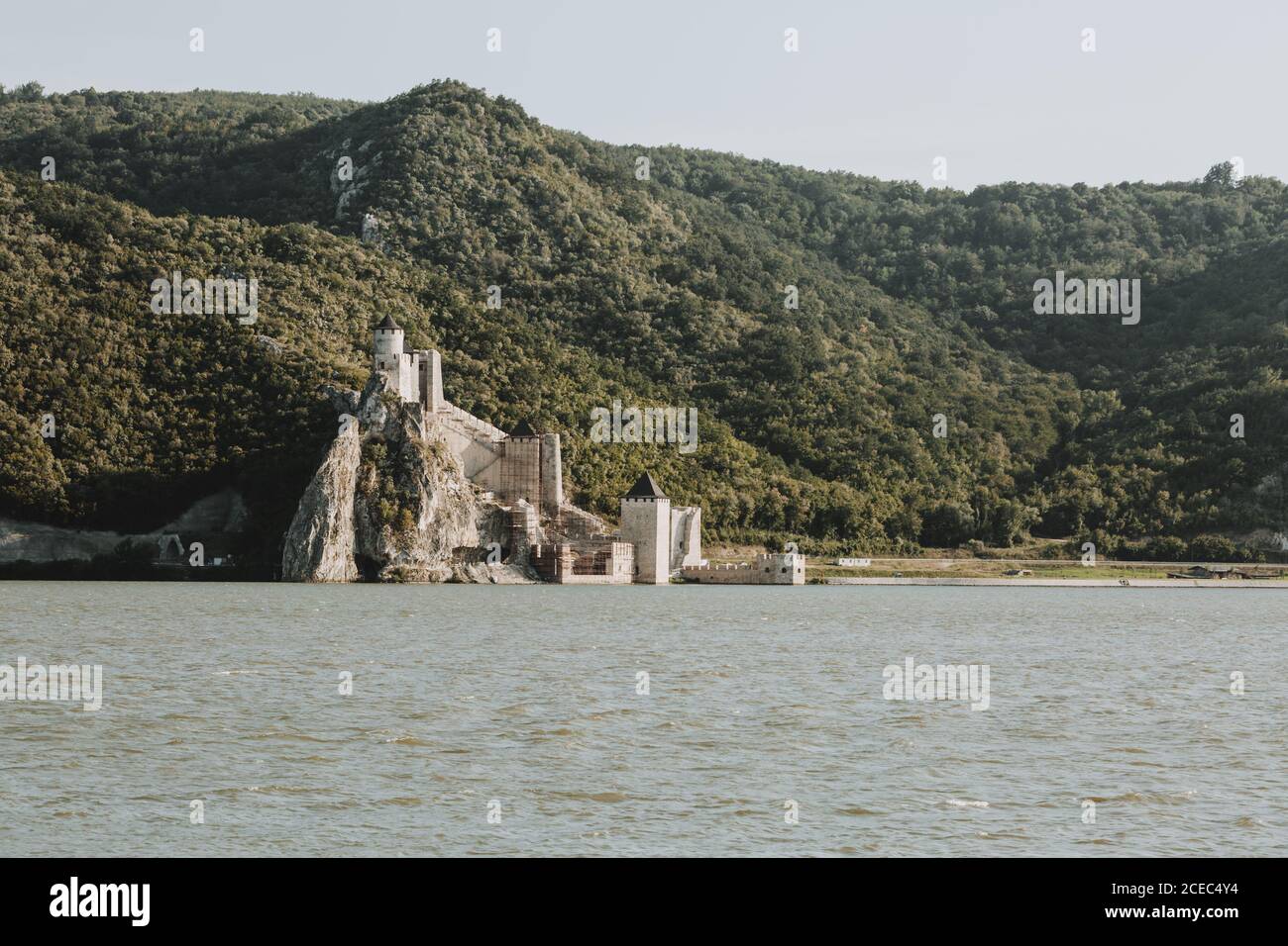 The view of the Golubac fortress on the banks of Danube river in Serbia on the Romania-Serbia border with forested hills in the background Stock Photo