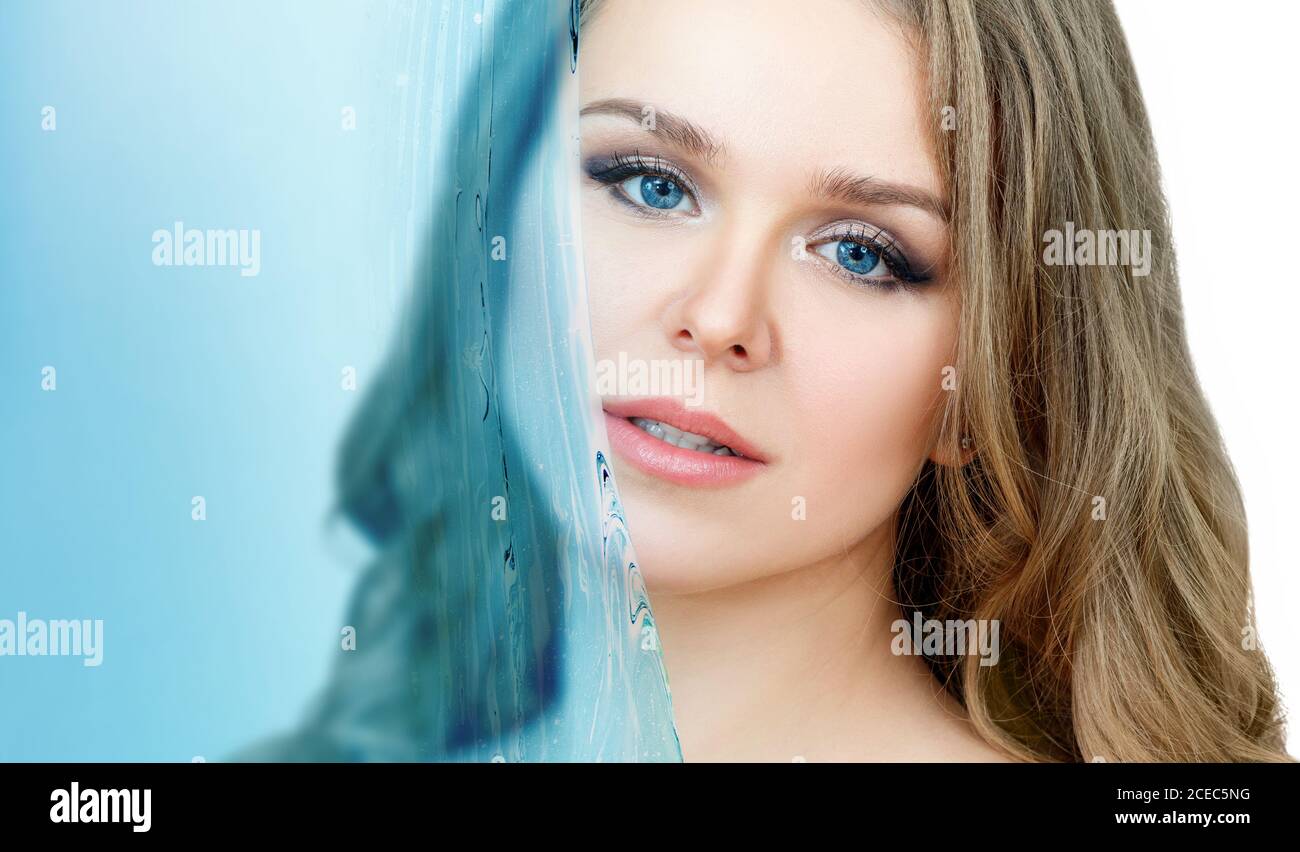 Close-up portrait of beautiful woman under water splash. Stock Photo