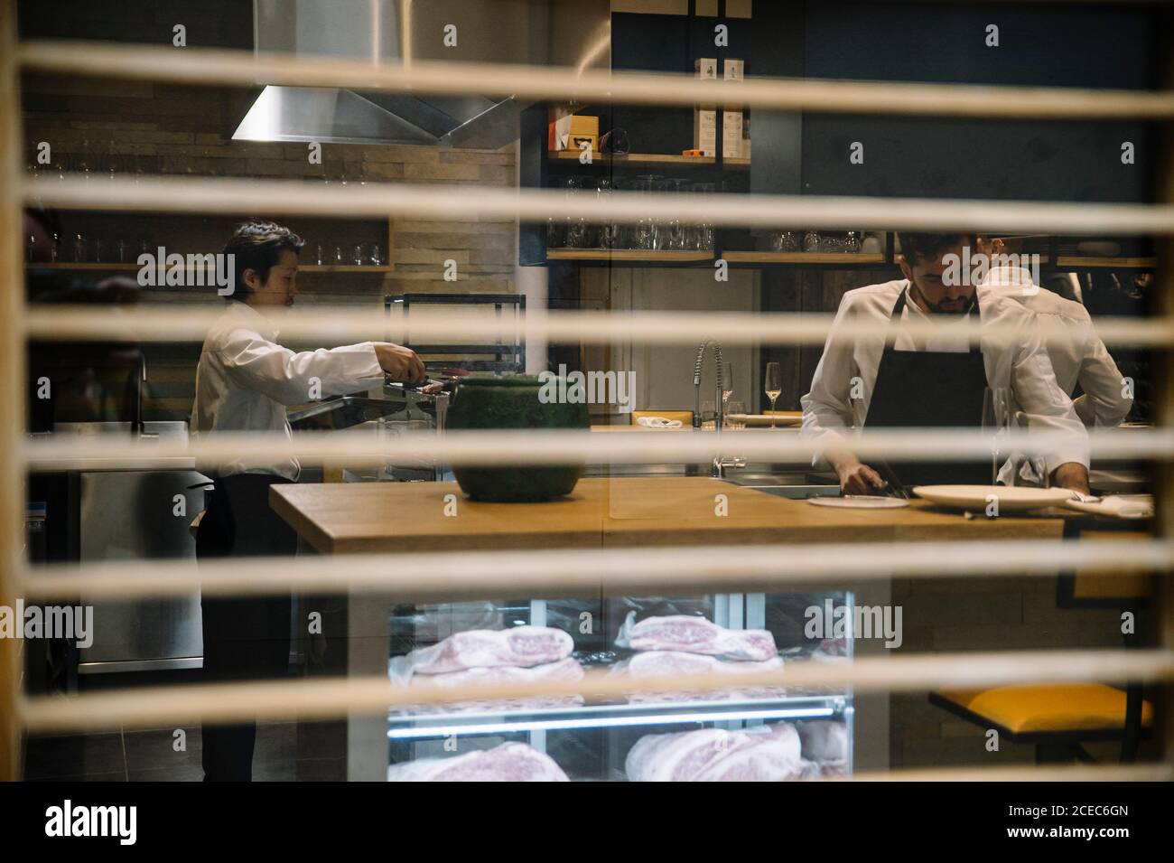Cooks cooking in restaurant Stock Photo