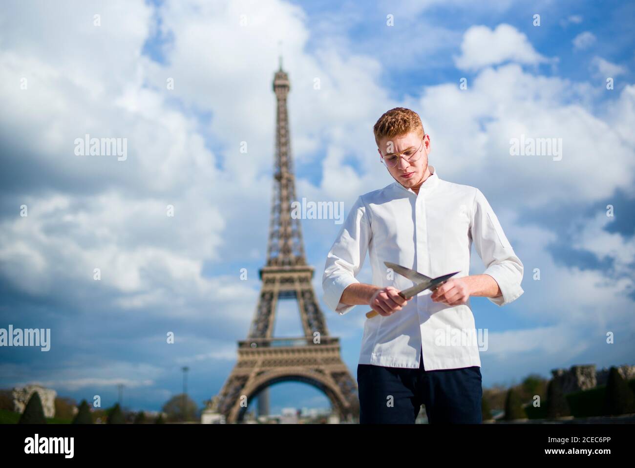 Red-Hair cook with knife in Paris Stock Photo
