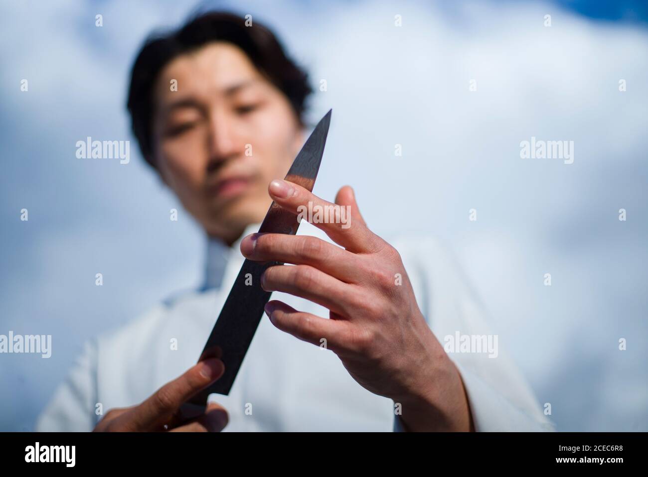 Japanese chef with knives in Paris Stock Photo