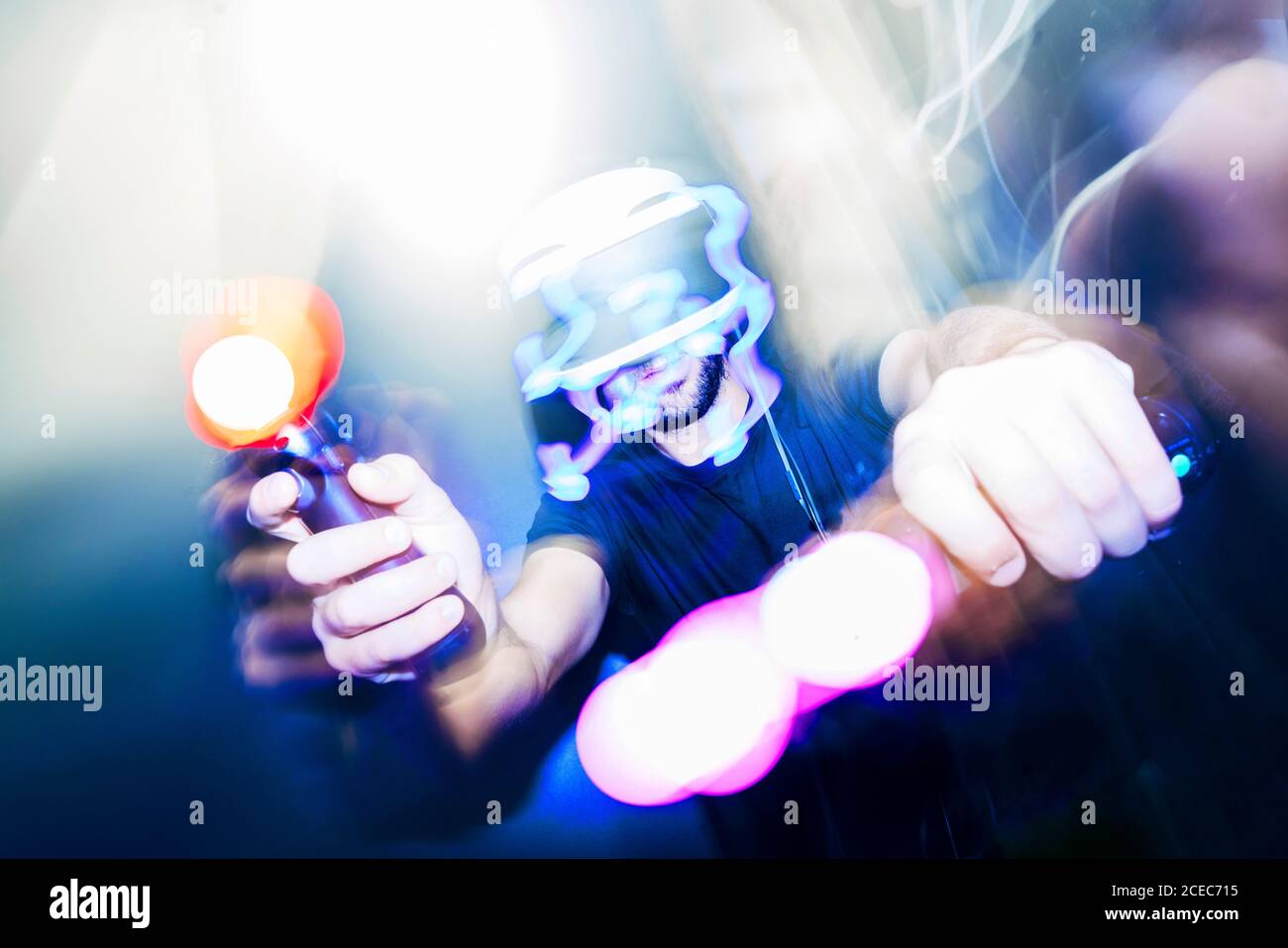 man playing video game in dark Stock Photo