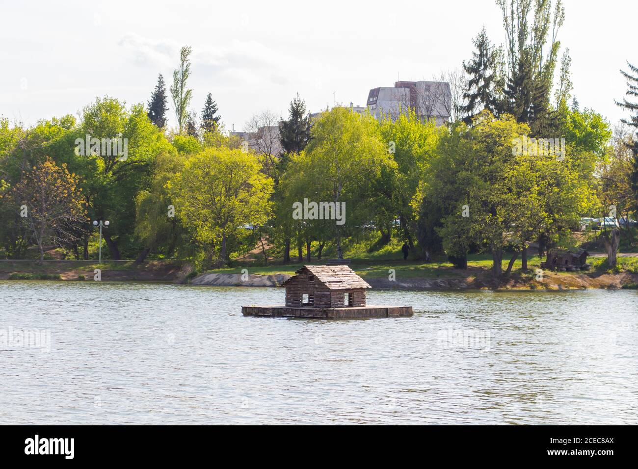 lake with a wooden duck cabin in the middle Stock Photo Alamy