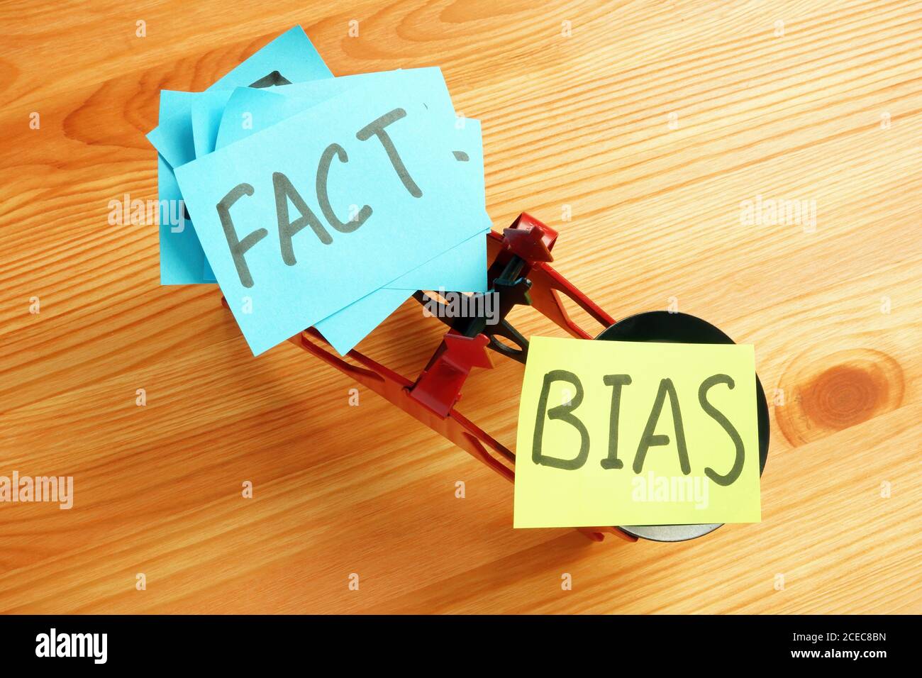 Scales with the words bias and facts. Stock Photo