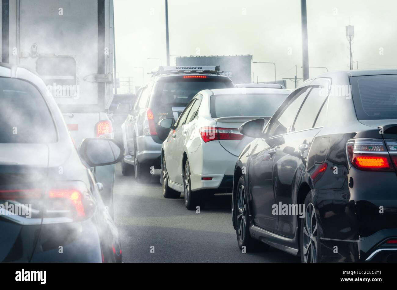 Smoke from the car exhaust on the road Stock Photo - Alamy