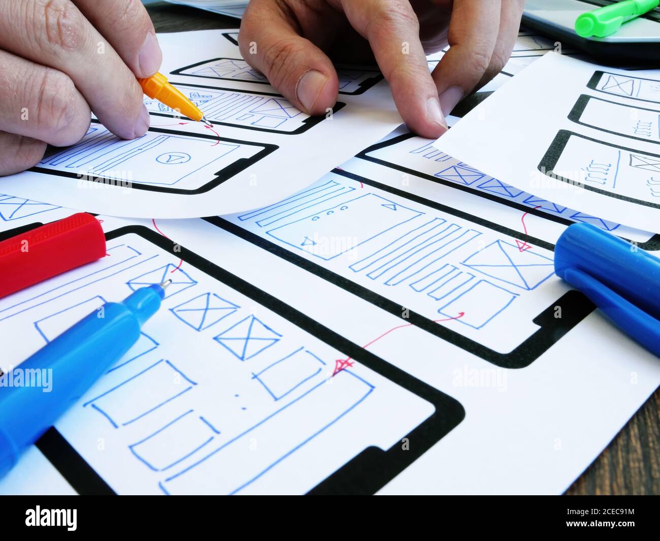 The Ux ui designer develops the design of a mobile application. Stock Photo