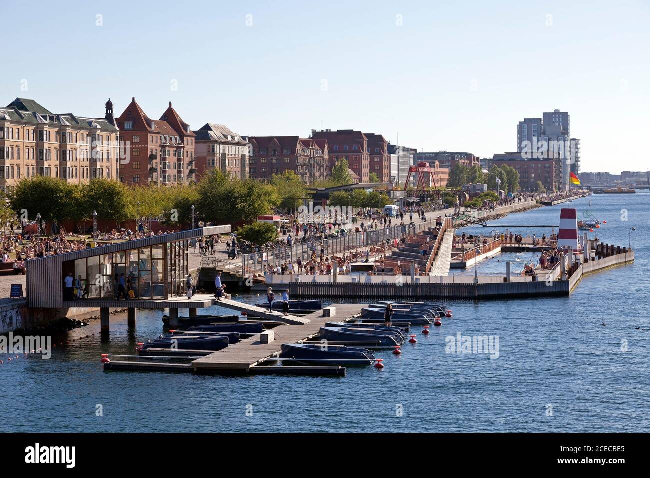 Crowded Goboat rental and Harbour Bath on Islands Brygge on summer afternoon. People bathing or