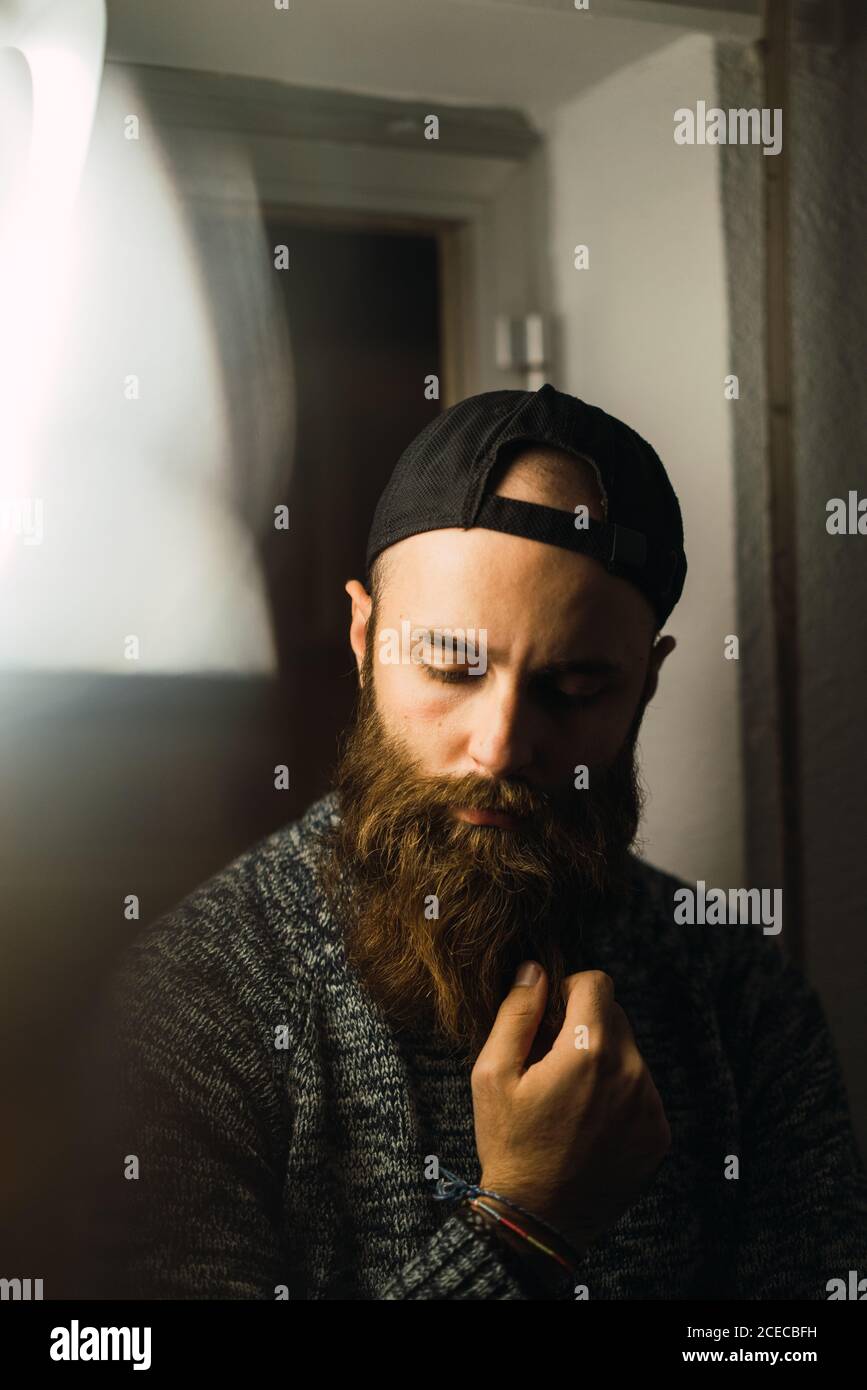 Portrait bearded young man cap hi-res stock photography and images - Alamy