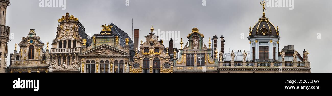 Baroque building facade boasts fine architecture and magnificent rooftop decorations in the Grand Place. Opulent exterior with renaissance guildhalls Stock Photo