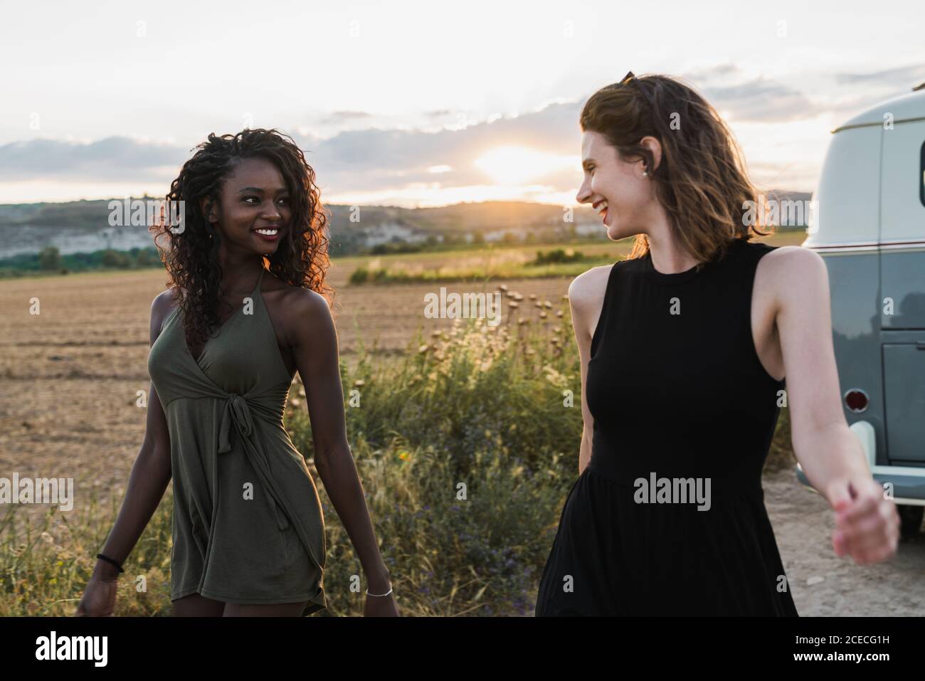 Two women walking near car hi-res stock photography and images - Alamy