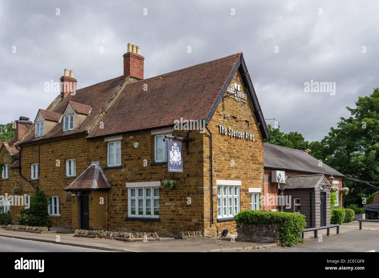 The Spencer Arms pub, Chapel Brampton, Northamptonshire, UK; traditional old pub previously a coaching inn. Stock Photo