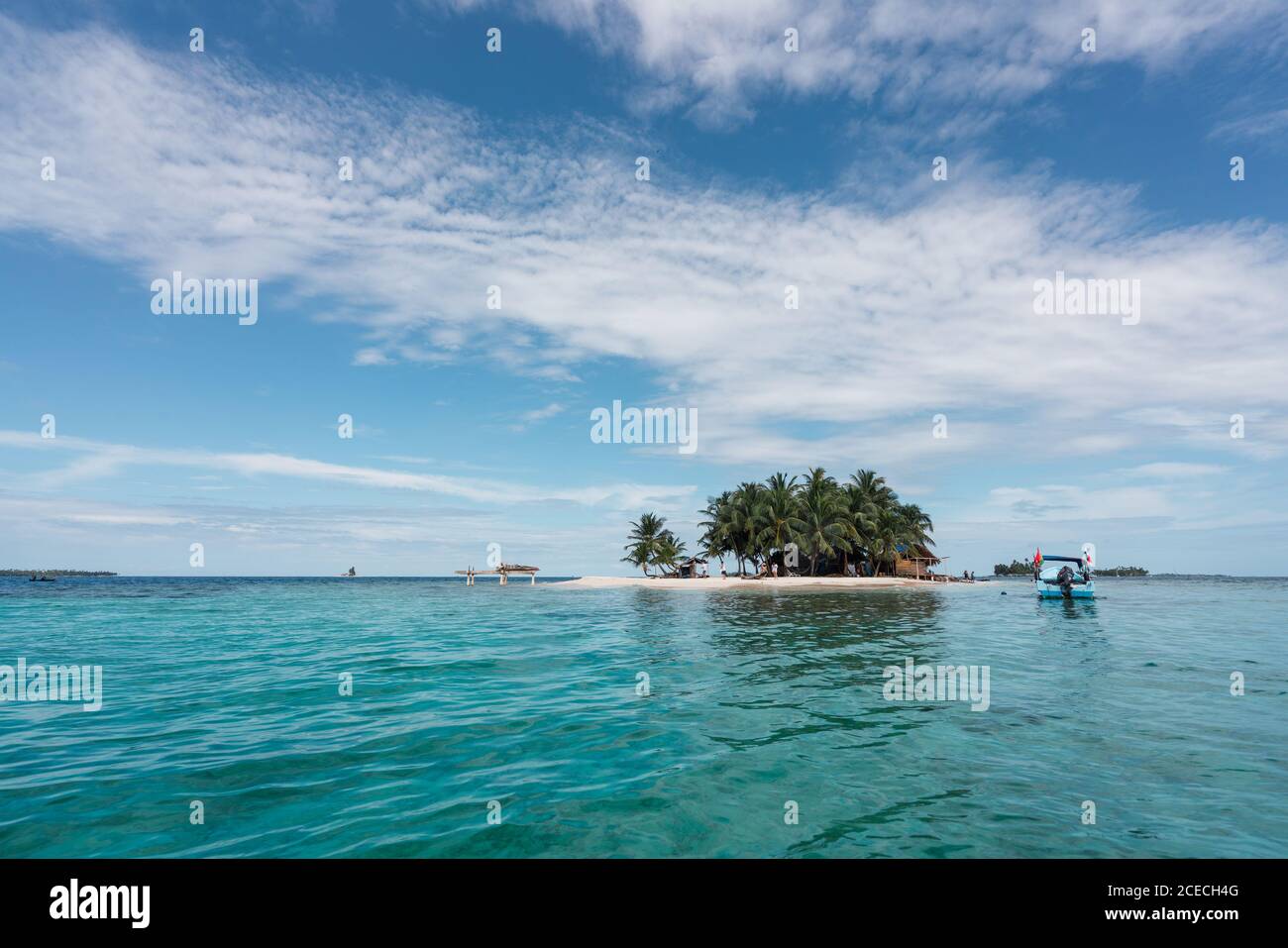 Little island with palms and building between water Stock Photo Alamy