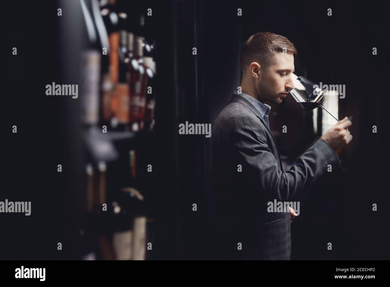 Winemaker sommelier man sniffing aroma red wine in glass Stock Photo ...