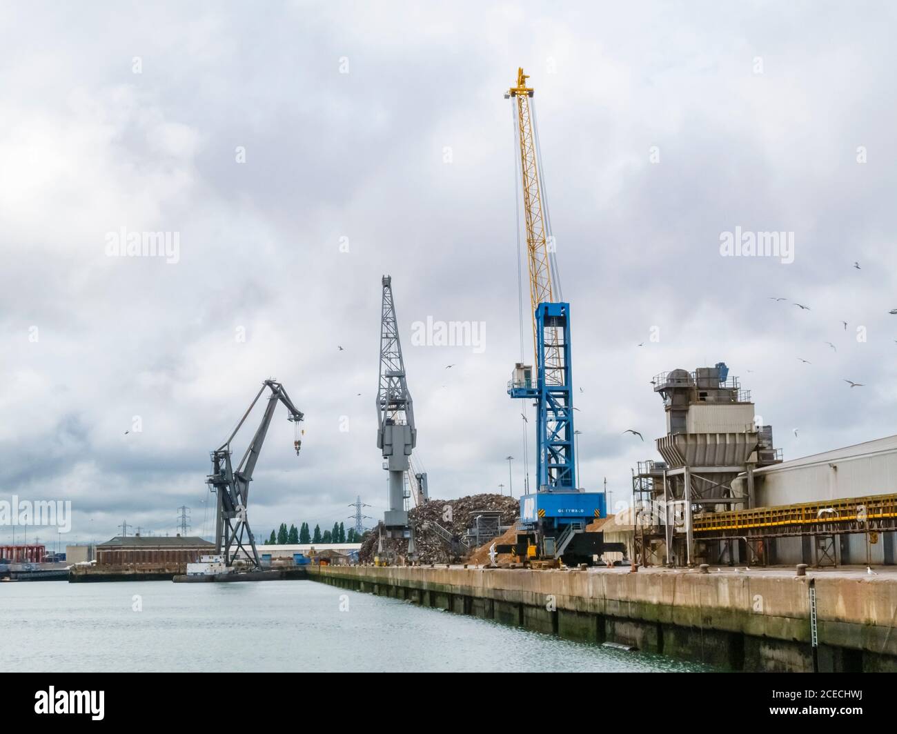 Row of moveable gantry cranes on the waterside of the docks at the Port ...