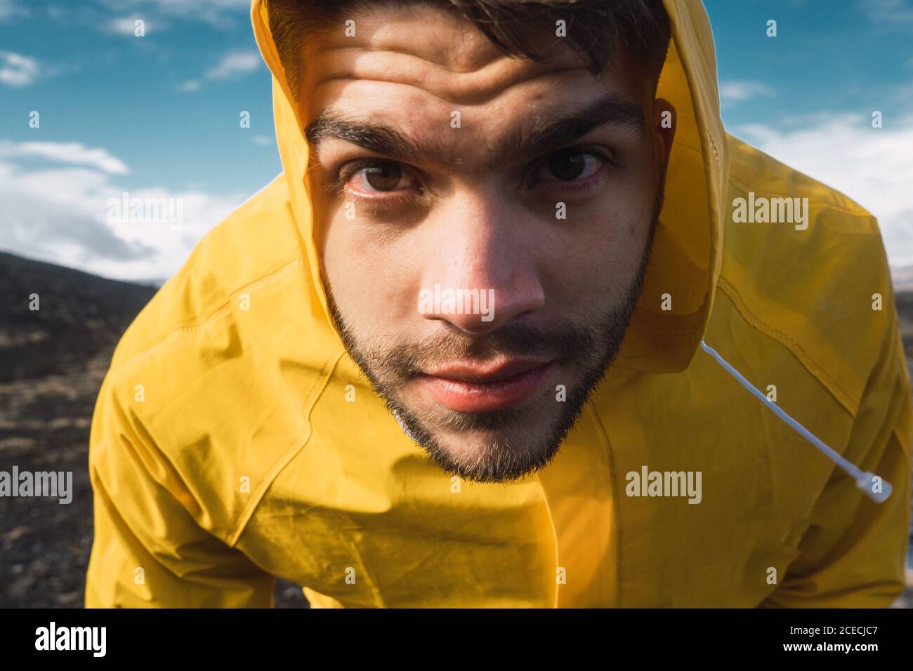man looking at camera in mountains Stock Photo