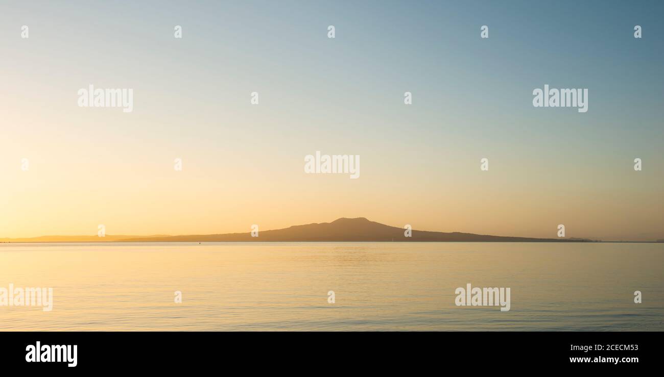 Simple tranquillity image of Ragitoto Island at sunrise Stock Photo