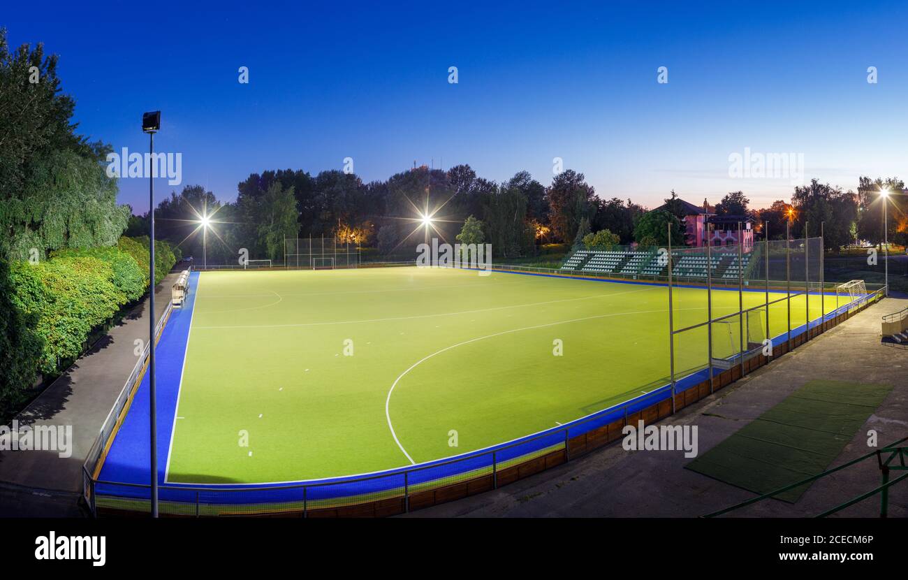 Field hockey stadium with lights at night Stock Photo