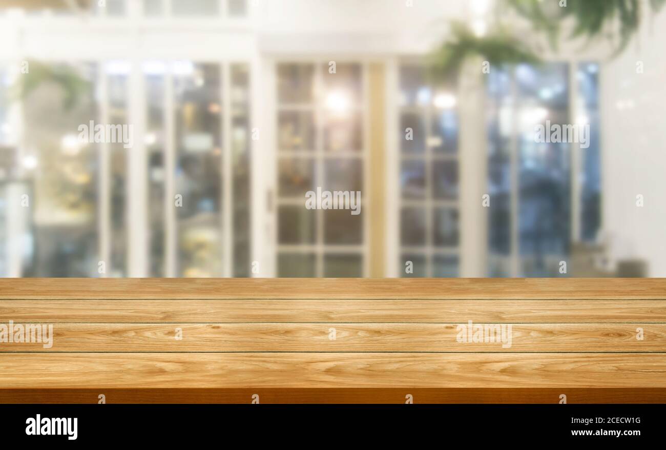 Wood table in blur background of modern restaurant Stock Photo