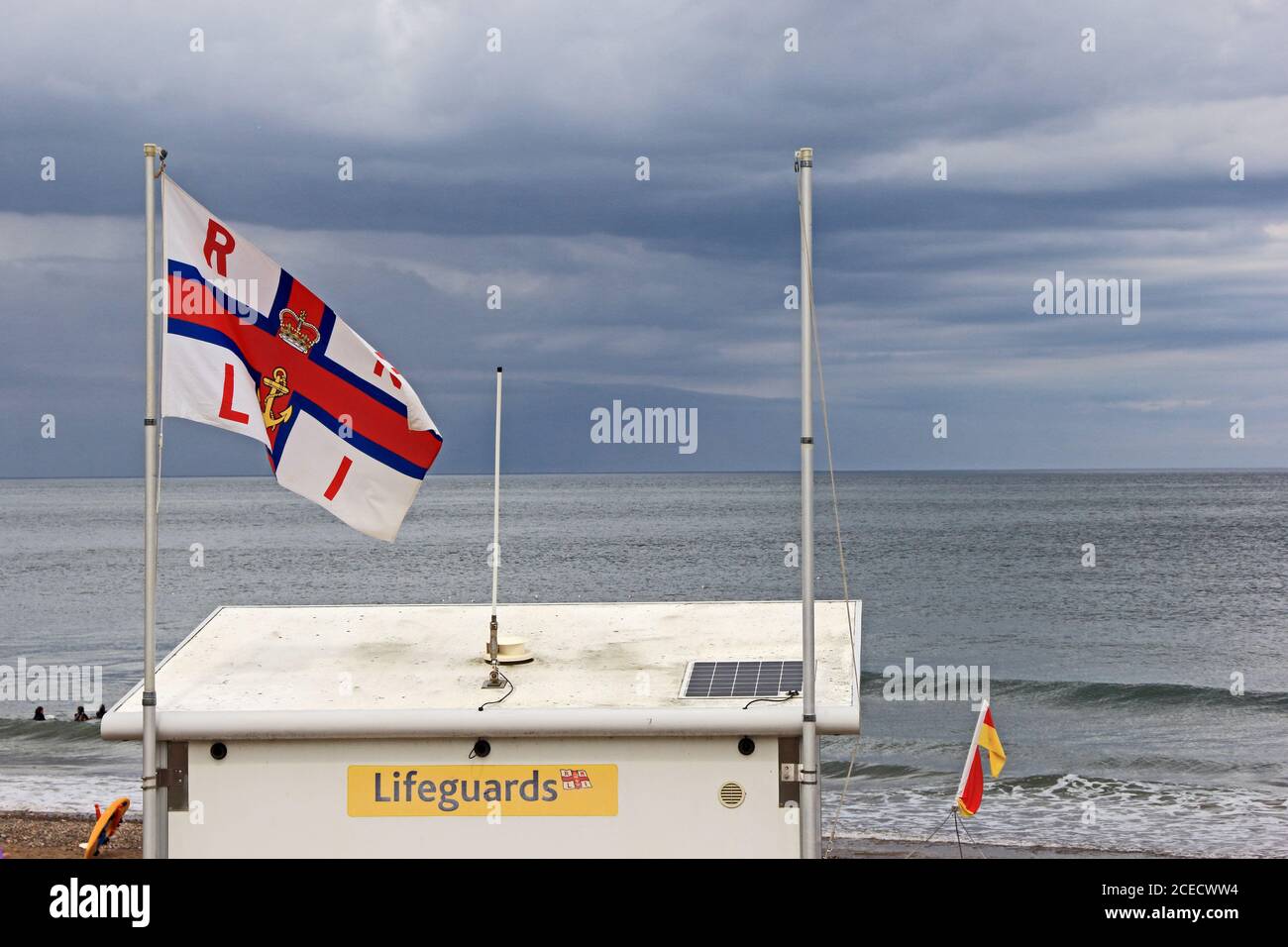 RNLI flag flying over Lifeguard Station, Sandsend, Whitby Stock Photo