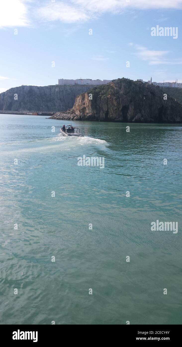 Vertical shot of a boat in a sea Stock Photo - Alamy