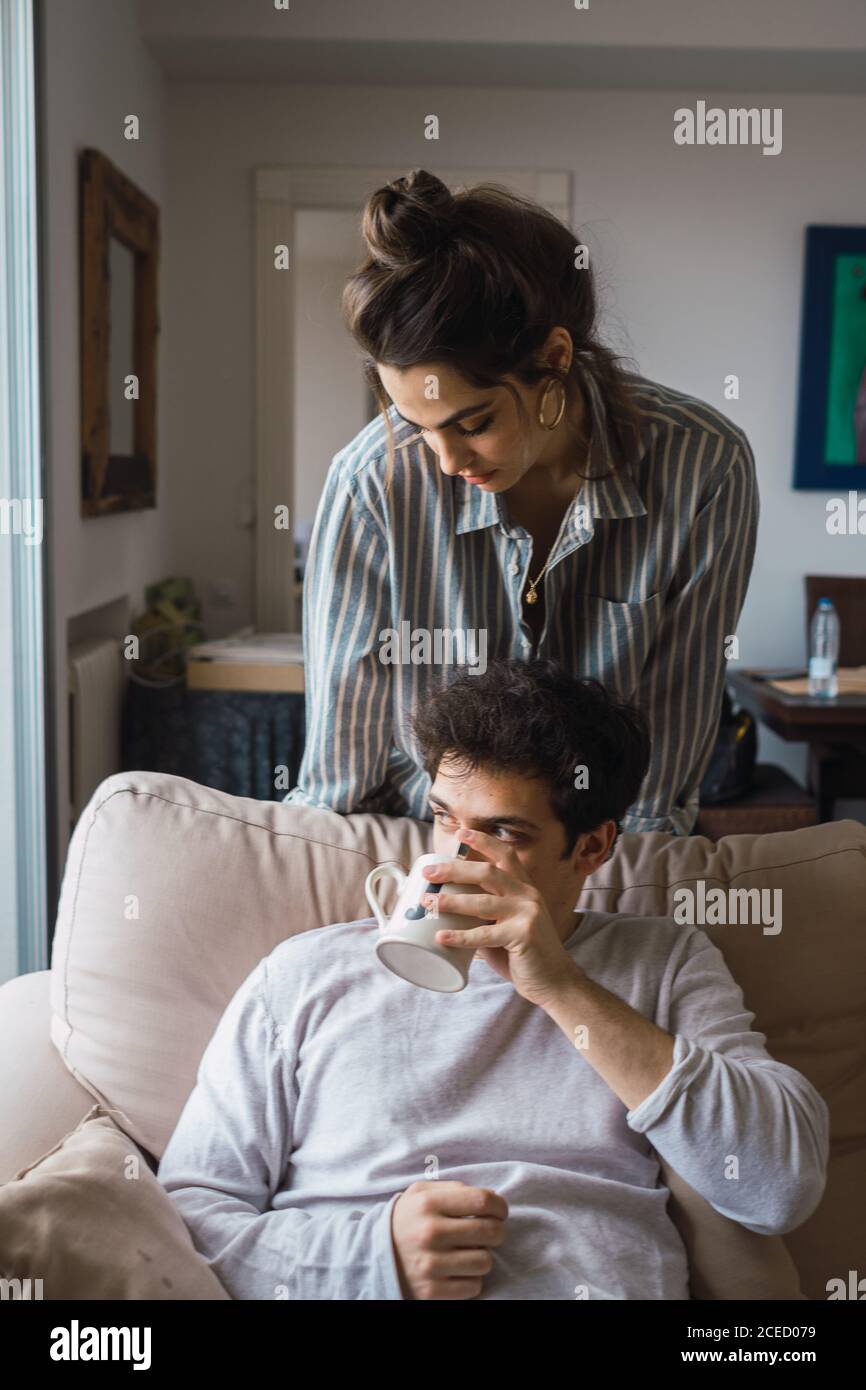 Cheerful couple having fun at couch Stock Photo