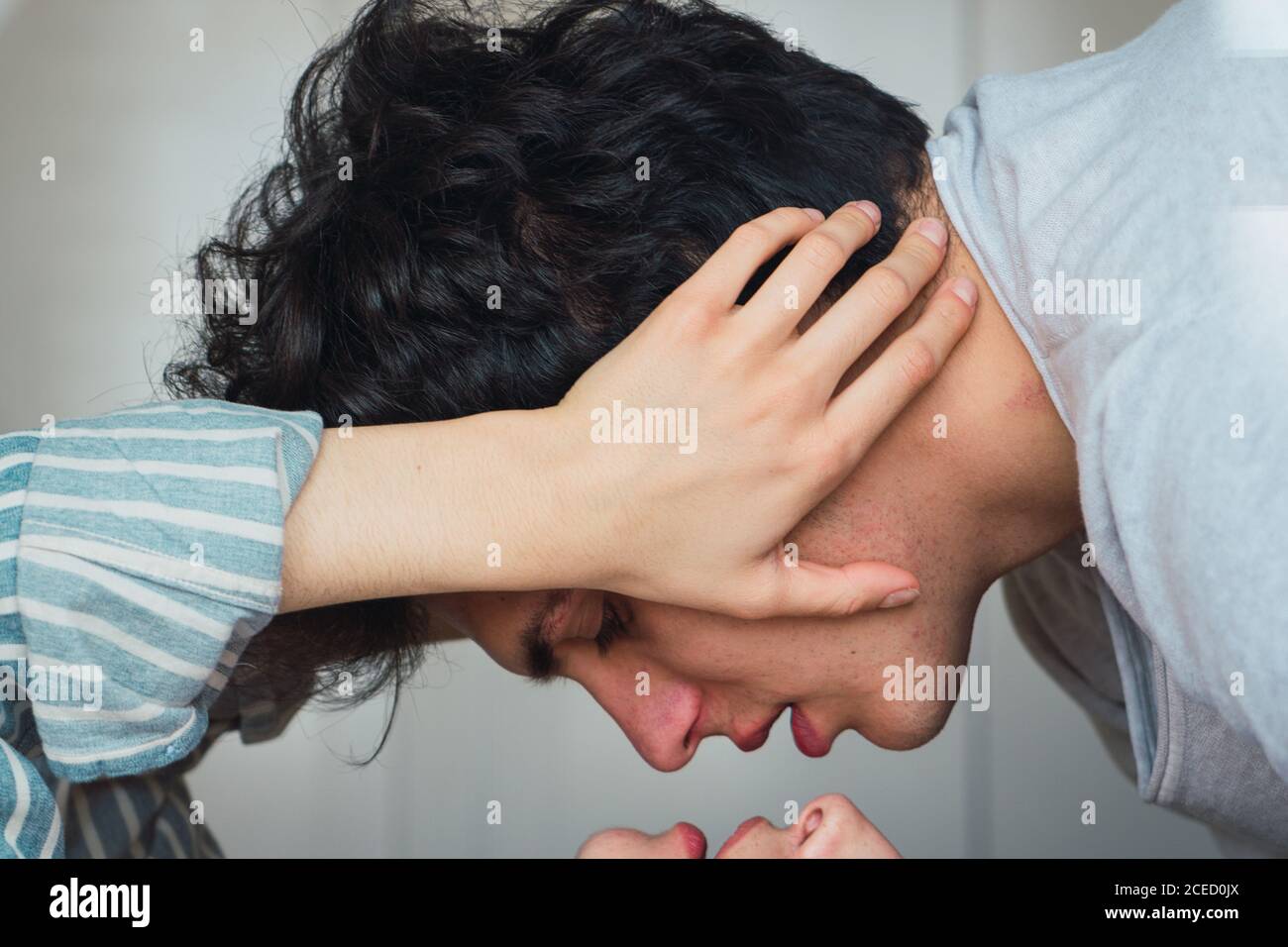 Tender couple lying on bed Stock Photo