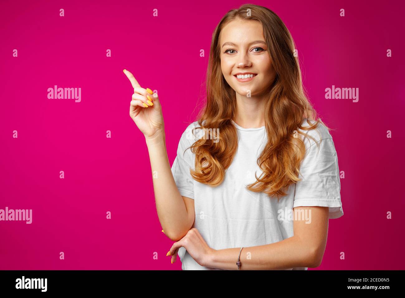 Portrait charming pretty cheerful girl showing copy space Stock Photo ...