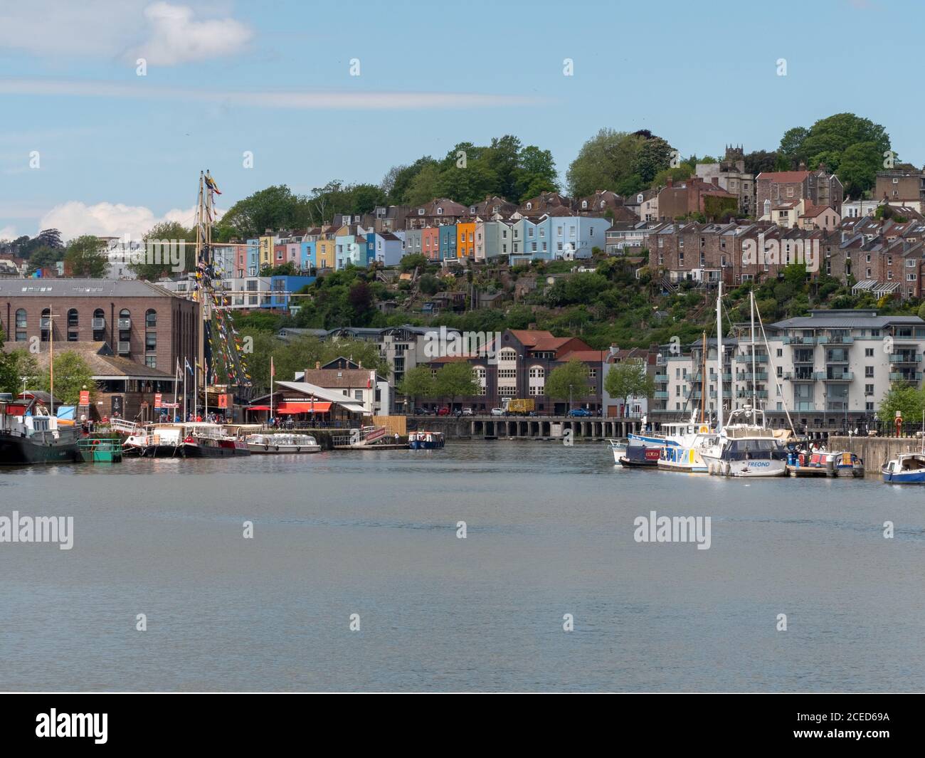 Old and coloured houses seen across Bristol Harbour, Bristol, UK. along