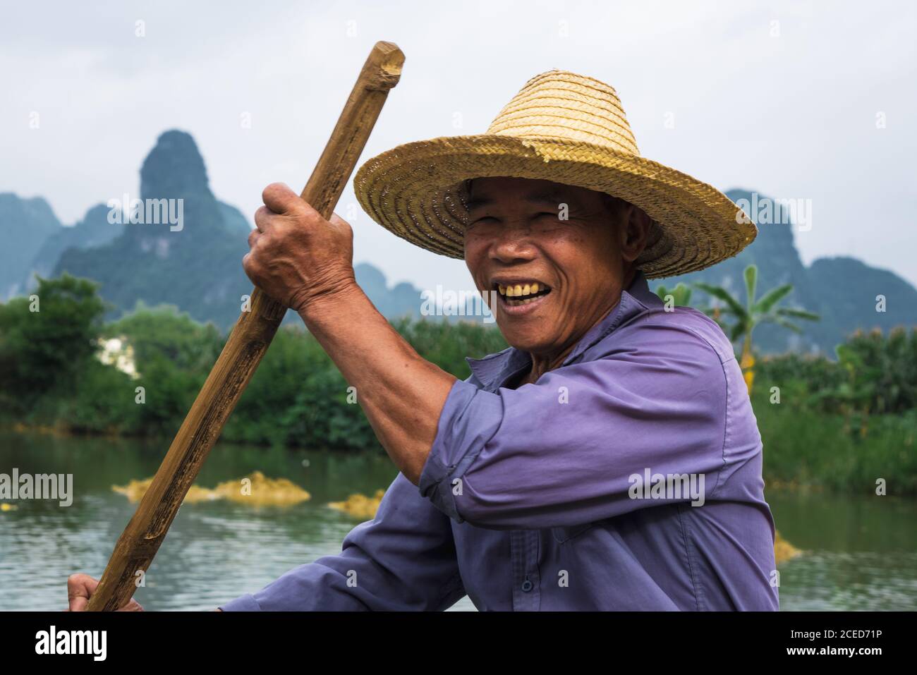 Premium Photo  Asian man in a hat fishing in the river