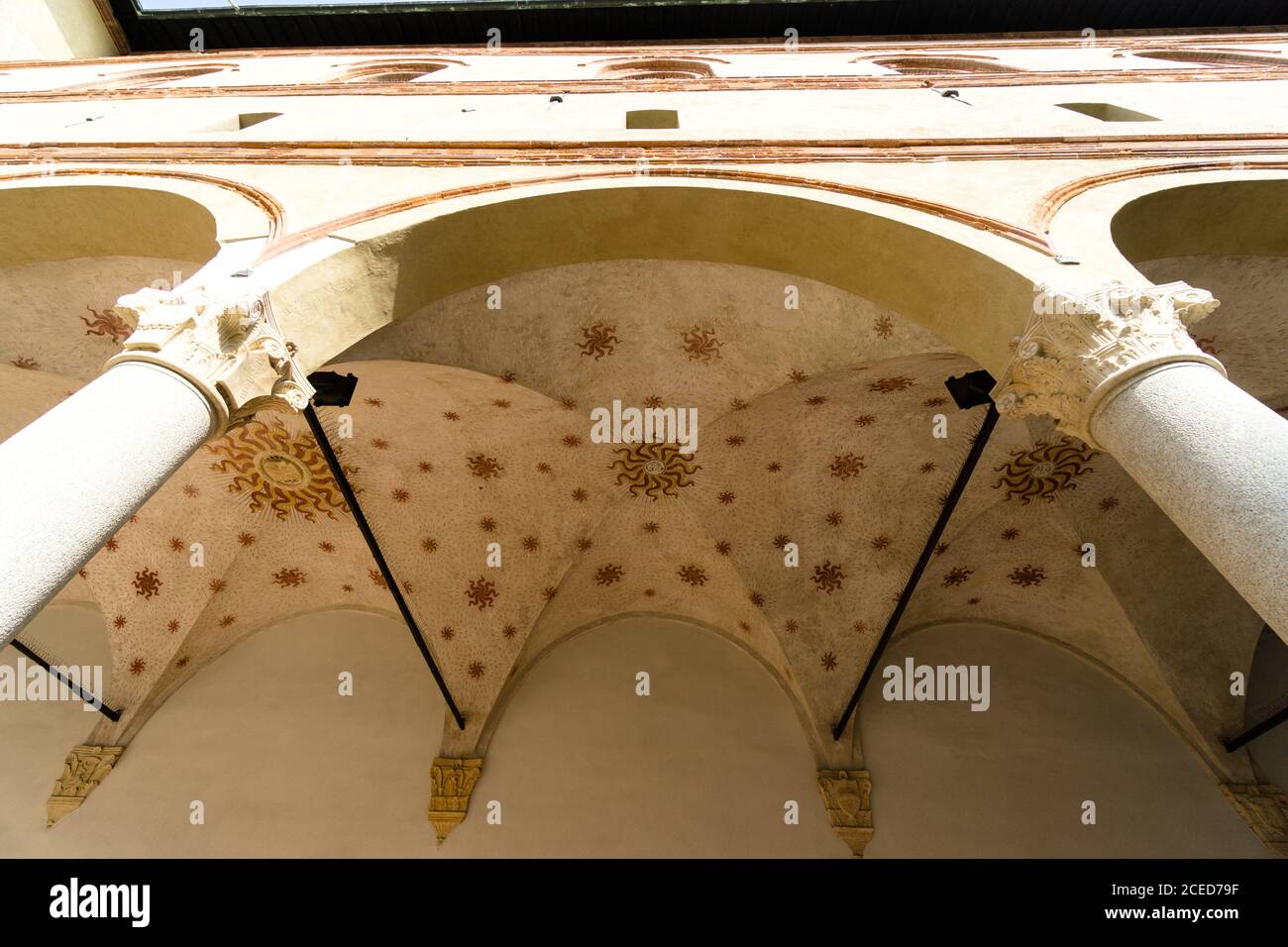 Low angle shot of an old building facade with a big arch Stock Photo ...