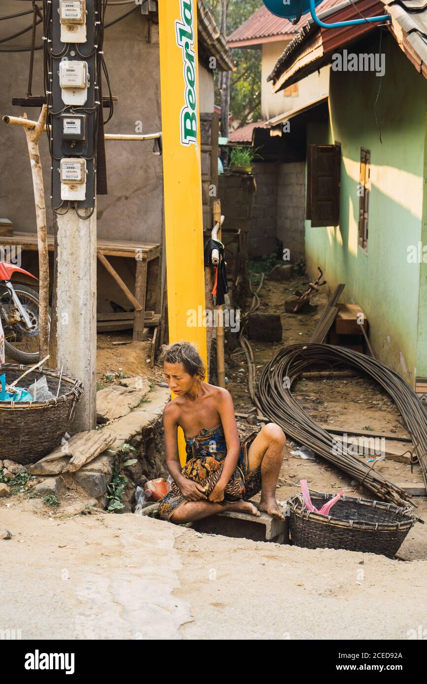 Stock Photohttps. www.alamy.compoor-homeless-asian-woman-sitting-and-leani...