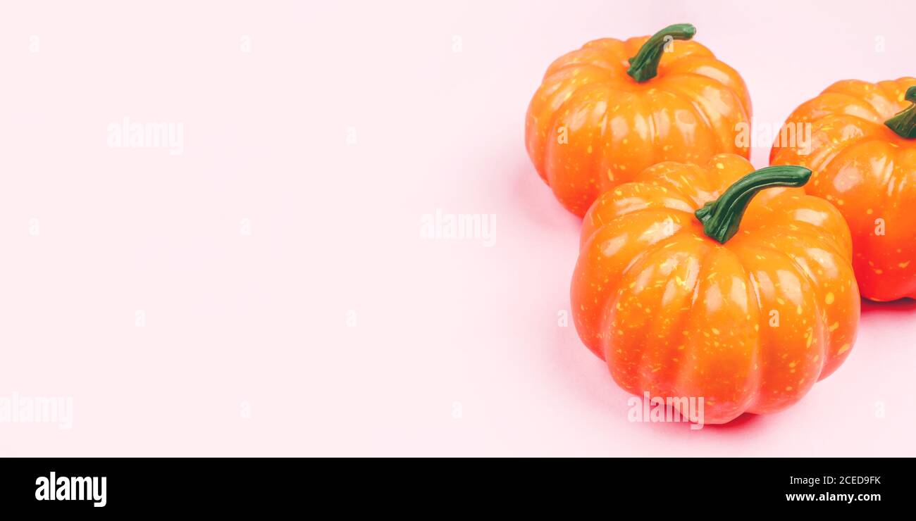 Pink background with pumpkins Stock Photo - Alamy