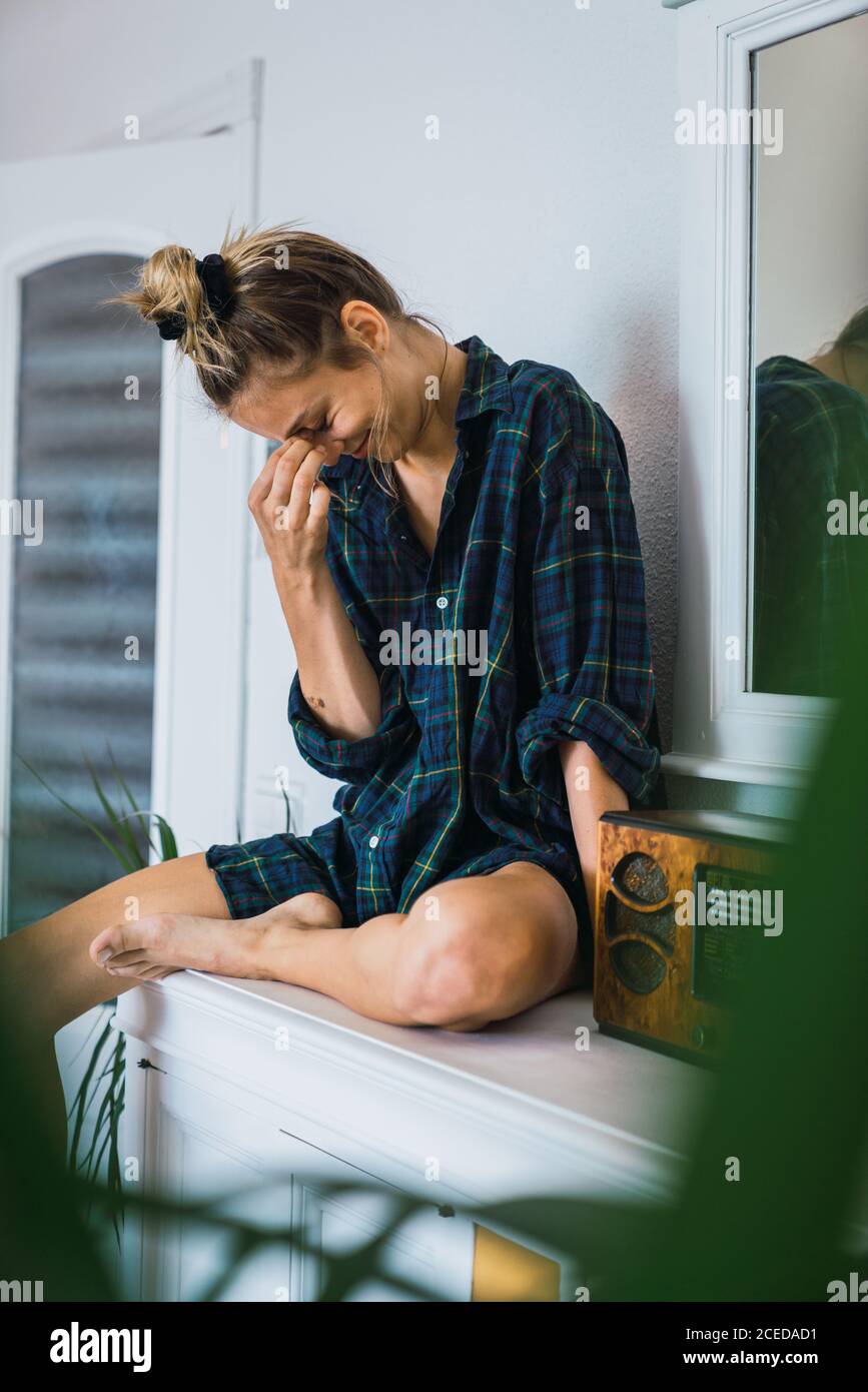 Lovely Woman sitting near radio unit Stock Photo