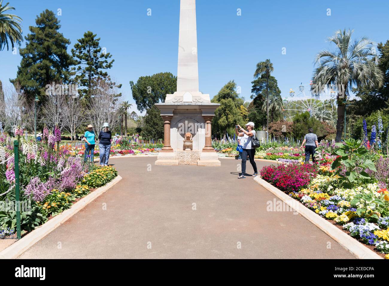 Visitors enjoying the beautiful floral garden displays in Queens Park during the Carnival of Flowers, Toowoomba, Queensland Stock Photo