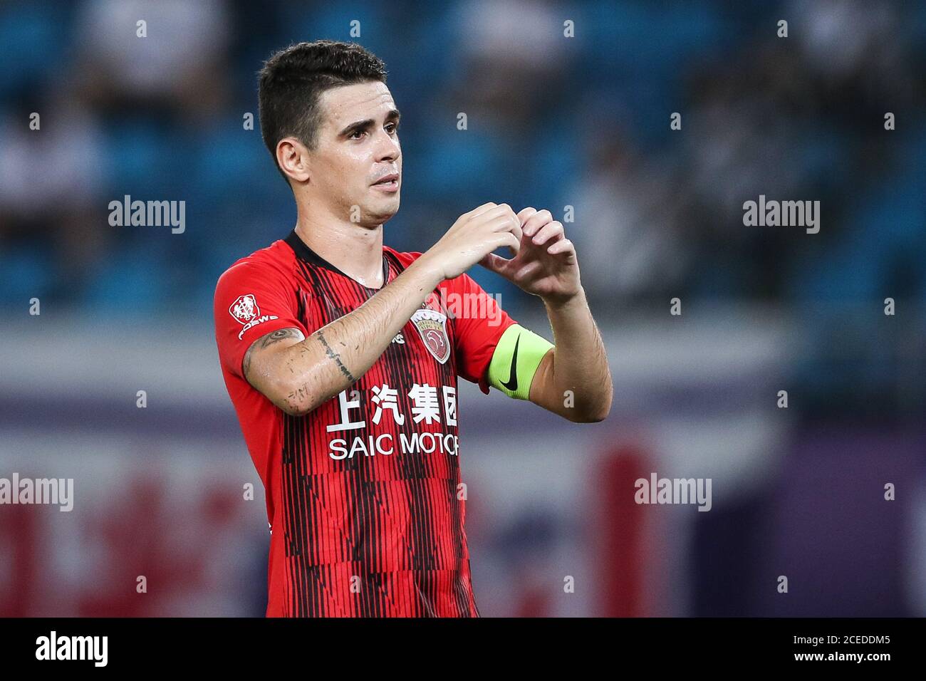 Brazilian football player Oscar dos Santos Emboaba Junior, better known as  simply Oscar, of Shanghai SIPG F.C. celebrates after scoring a goal during  the eighth-round match of 2020 Chinese Super League (CSL)