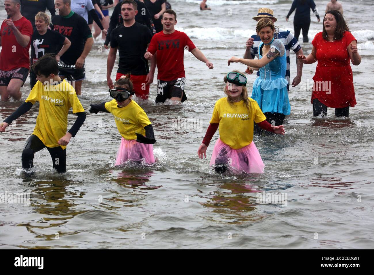 Prestwick, Ayrshire Scotland 19 Feb 2017 : When the chairty Clic Sargent  closed their holiday home the Malcolm Sargent House at Prestwick a group of volunteers got together to save the home & purchase it. They organised a dip in to the sea outside the home on Valentines day Stock Photo