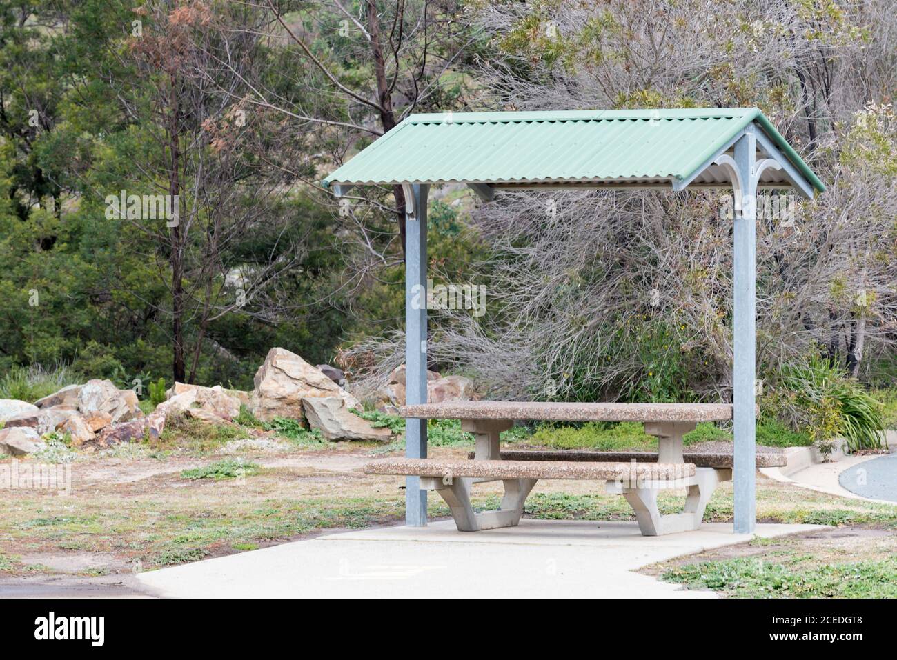 A post war modern or modernist design public picnic table and chair set near Lake George, New South Wales, Australia Stock Photo