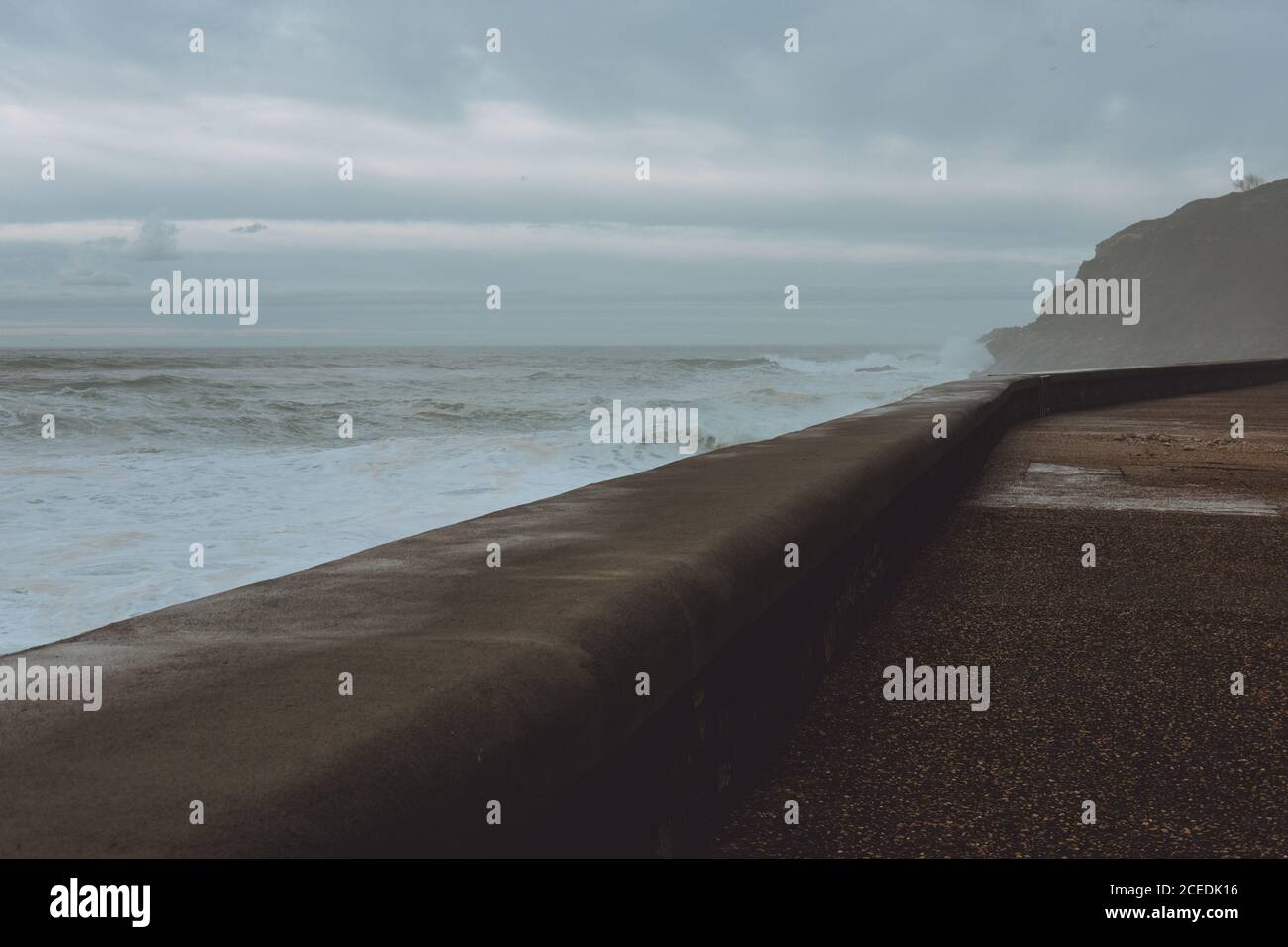 Paved empty waterfront in storm Stock Photo