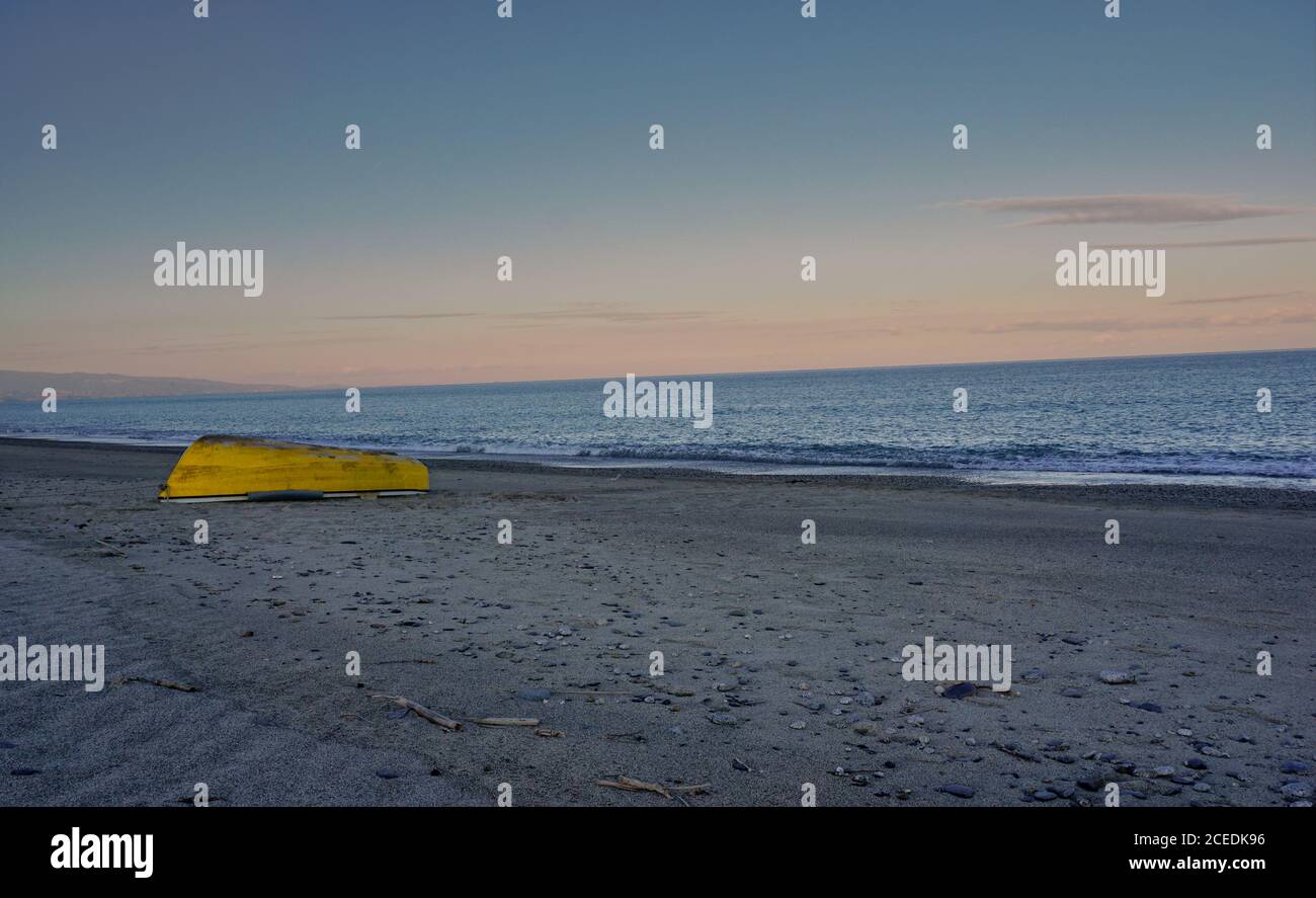 A beautiful sunset on the beach in Isca, a popular place in Italy. Stock Photo