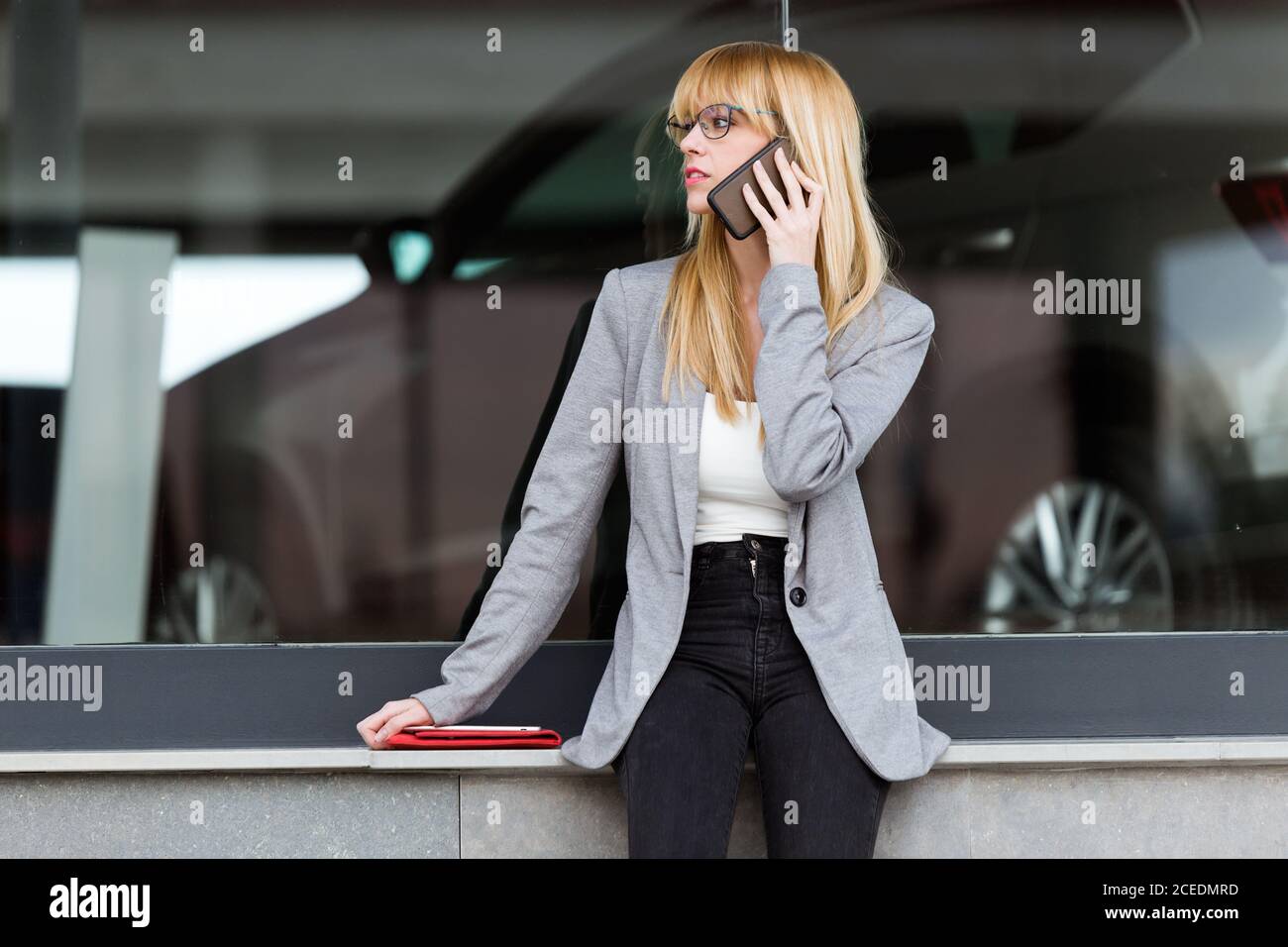 Young beautiful Woman talking on phone Stock Photo