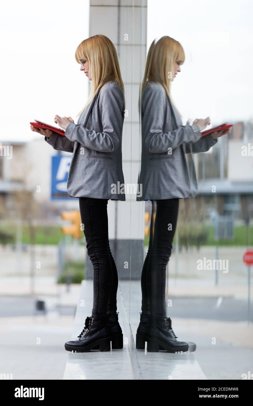 Young attractive Woman standing with tablet Stock Photo