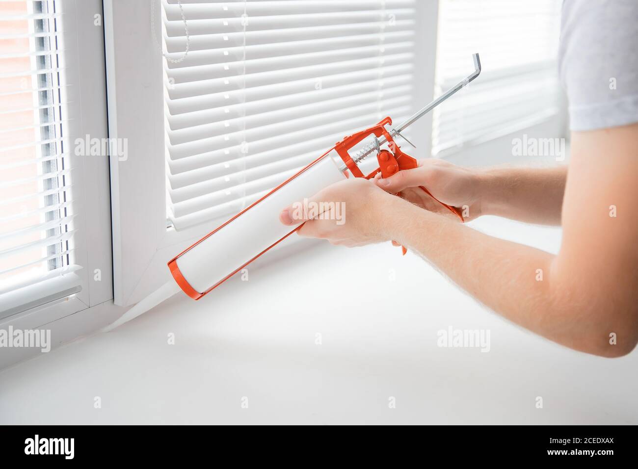 Construction worker use gun silicone tube for repairing and installing