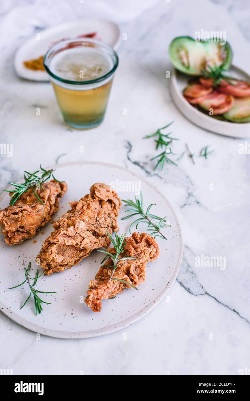 Roasted chicken near spices and tomatoes Stock Photo Alamy