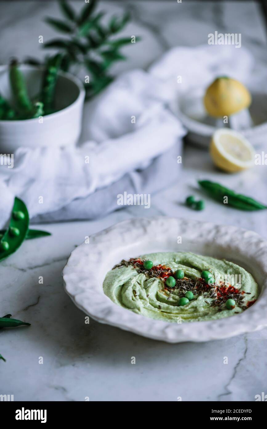 Bowl with tasty mashed peas Stock Photo