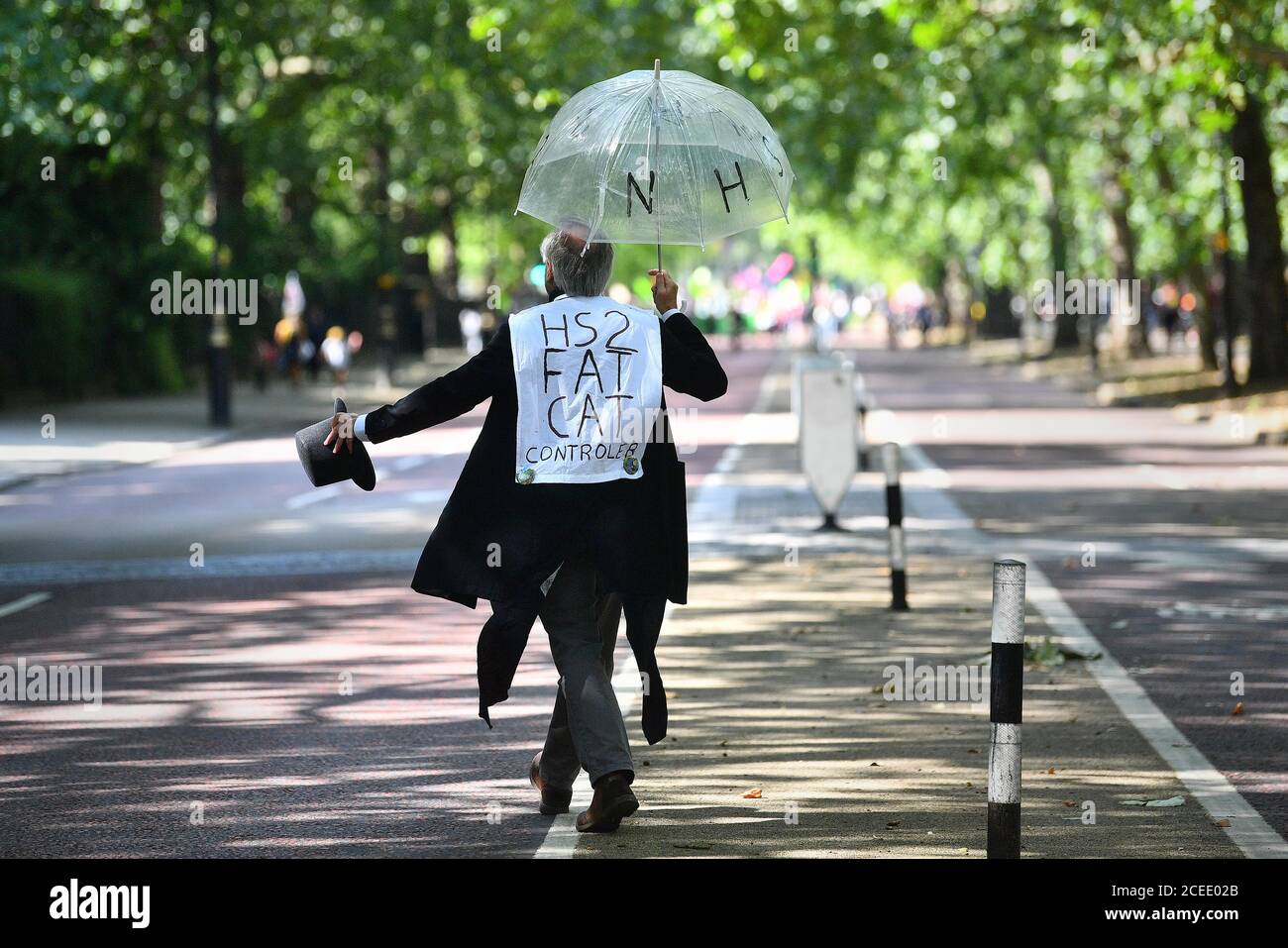 An Extinction Rebellion protester near Buckingham Palace in London. The environmental campaign group has planned for marches to be held at several landmarks in the capital, before moving to Parliament Square in Westminster. Stock Photo